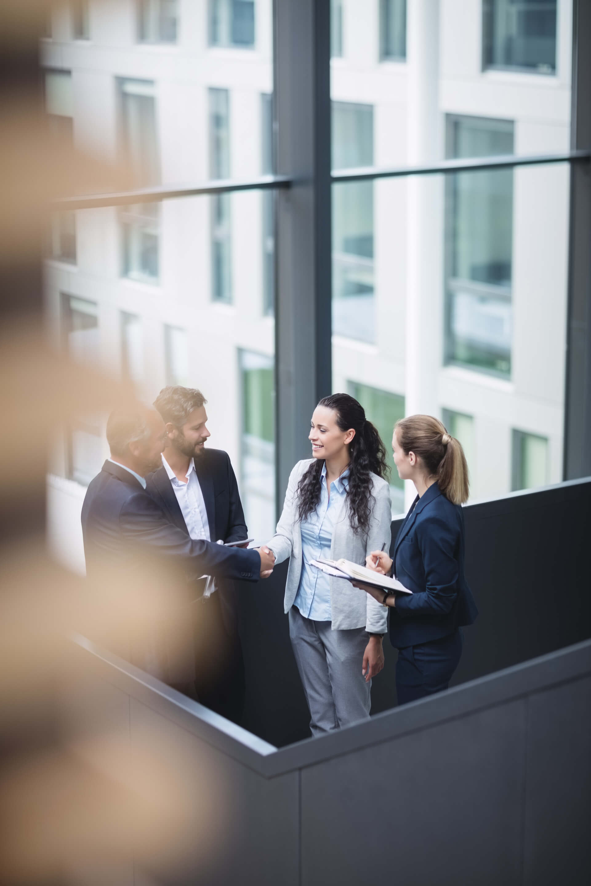 businesspeople-having-discussion-office